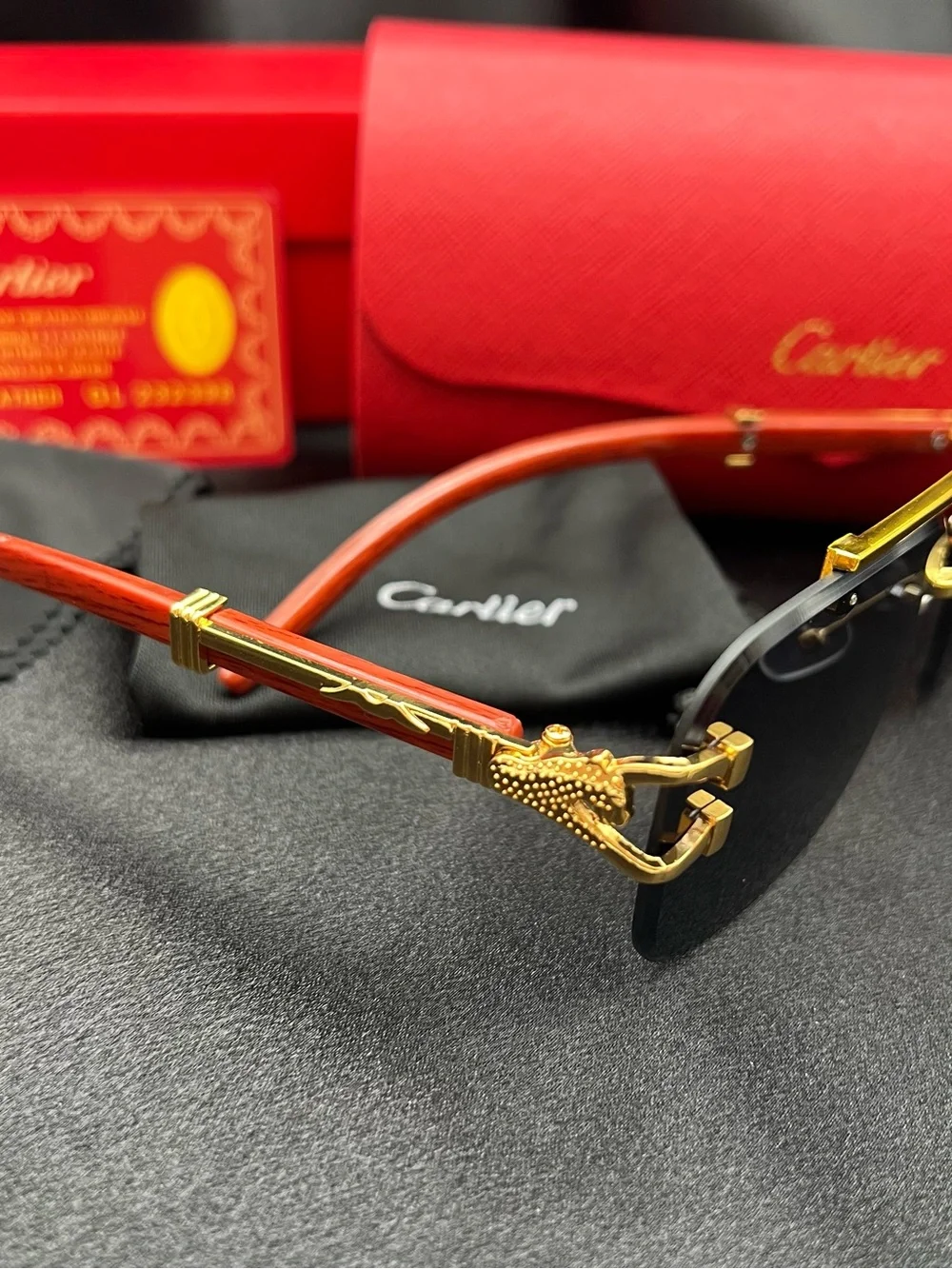 Cartier Men’s Black and Gold Rimless Sunglasses